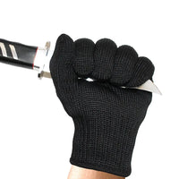 Thumbnail for Black knitted safety glove pictured gripping a knife blade
