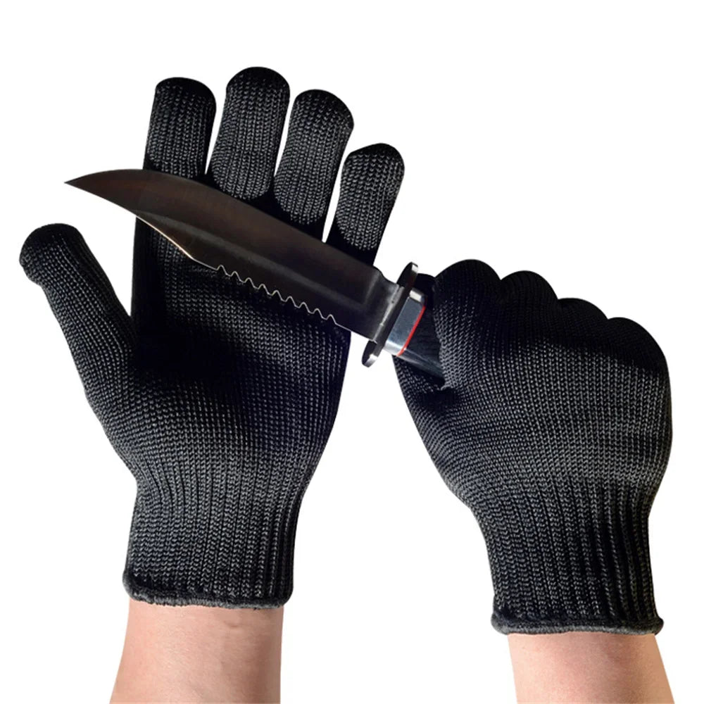 Black knitted safety gloves pictured with a knife across the palm